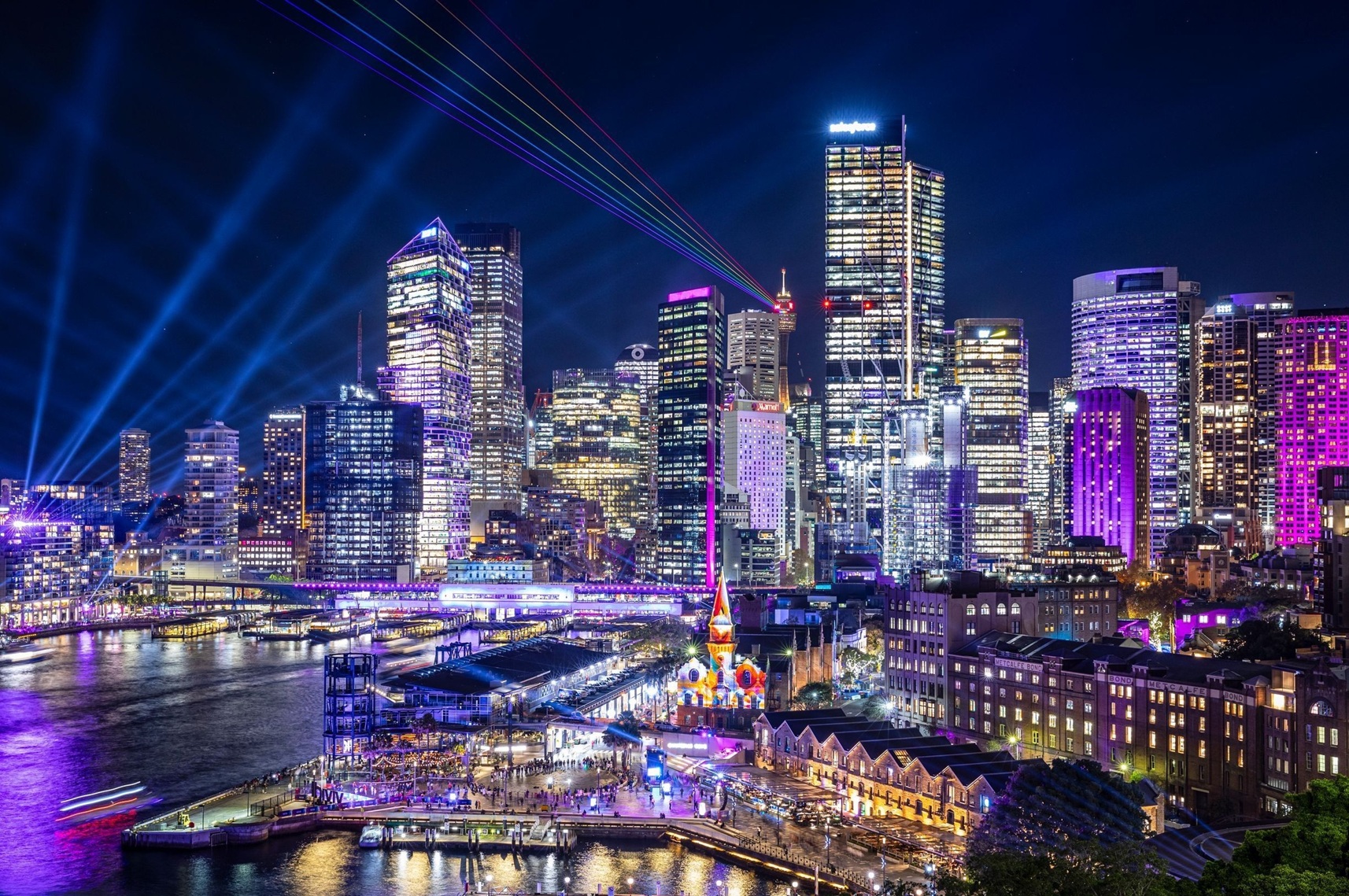 View of Sydney cityscape lit up during Vivid Sydney 2024