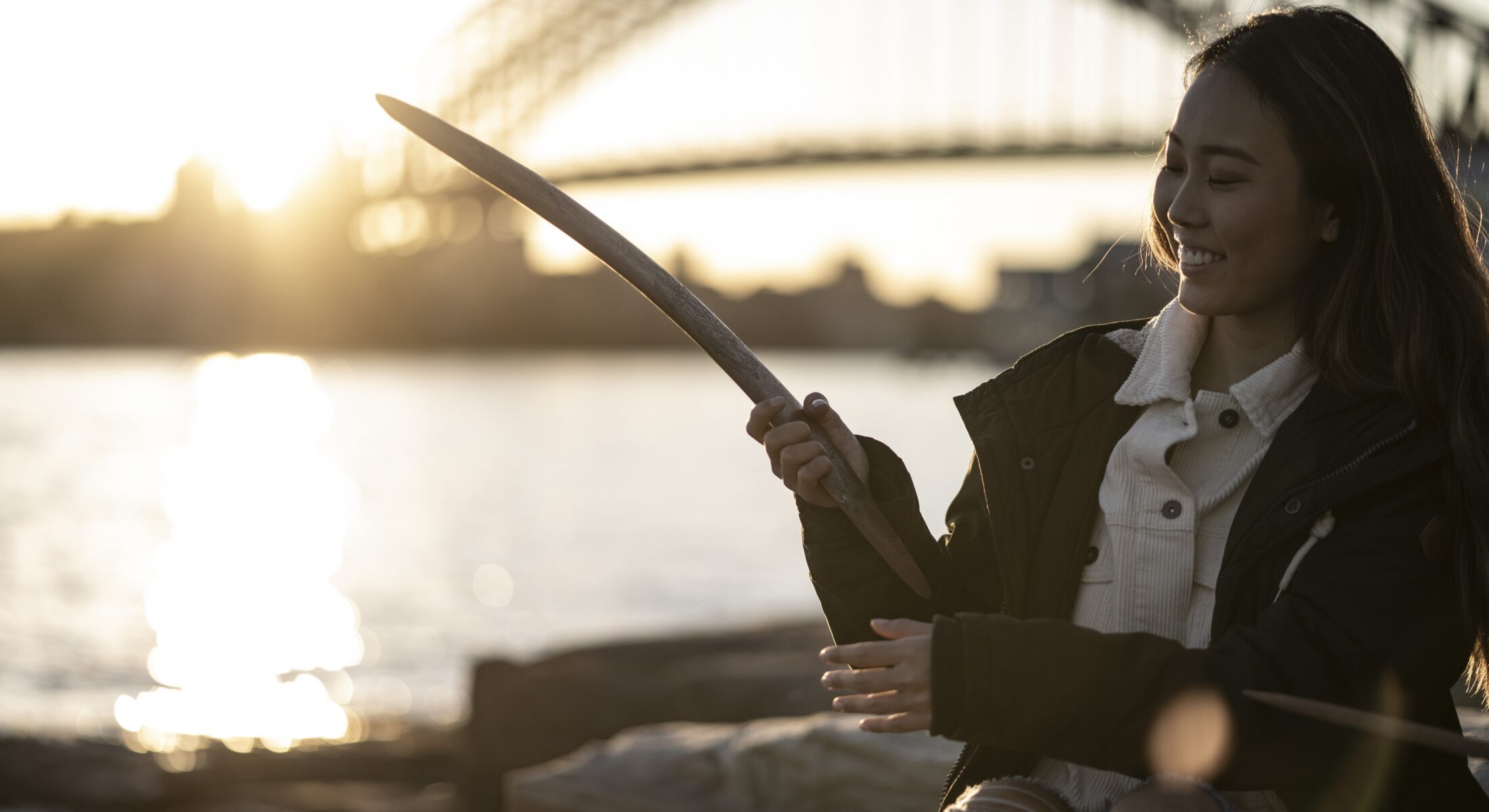 Woman learning about Aboriginal culture on a tour with Aboriginal Cultural Tours, Barangaroo Reserve.